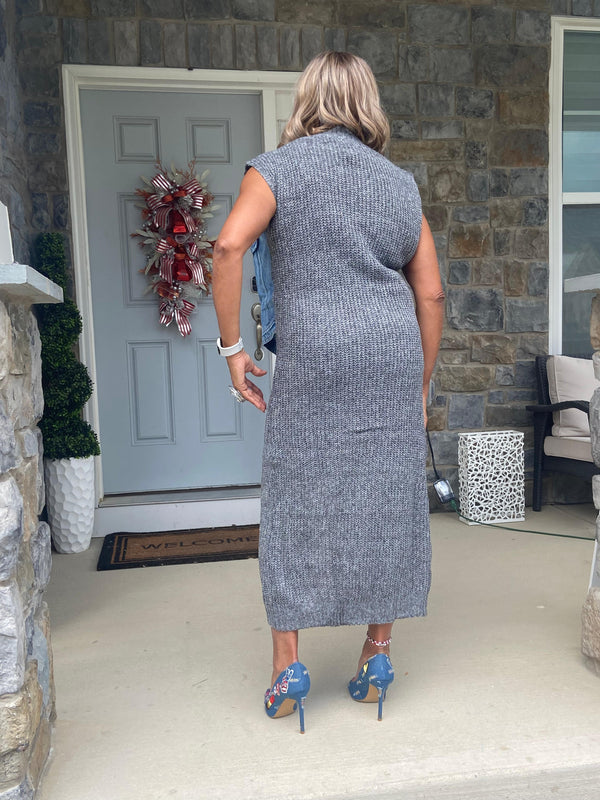 Sweater and denim dress with a high split