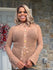 Sheer long sleeve blouse with jeweled button closures.