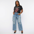 files/put_these_jeans_on_a_size_medium_african_american_woman_with_a_graphic_t_shirt_and_high_heels_with__bap21vmmee8dvjj3yps8.png